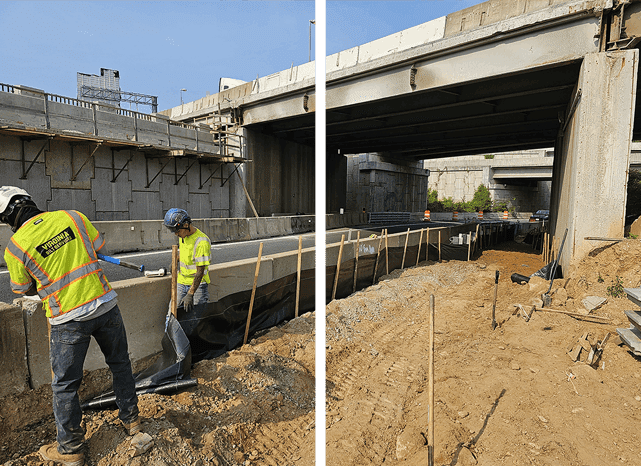 Two men in yellow jackets working on a bridge.