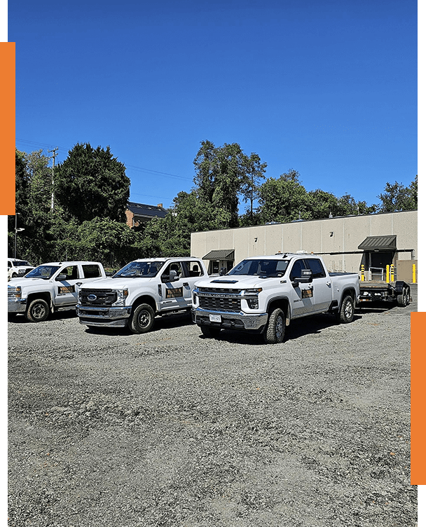 A group of trucks parked in front of a building.