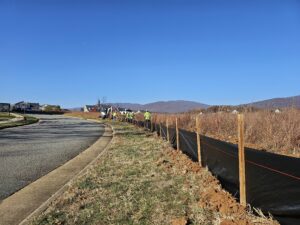 Construction workers building a fence.